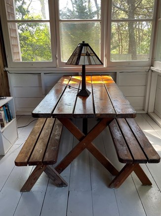 Walk to Wellfleet Ctr. Cape Cod vacation rental - One end of Enclosed porch picnic table seats 6