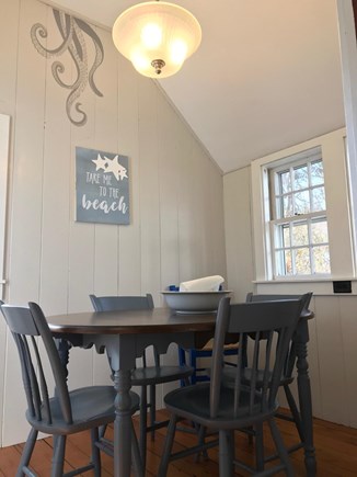 West Dennis Cape Cod vacation rental - Cozy dining room has lots of windows and door to back yard