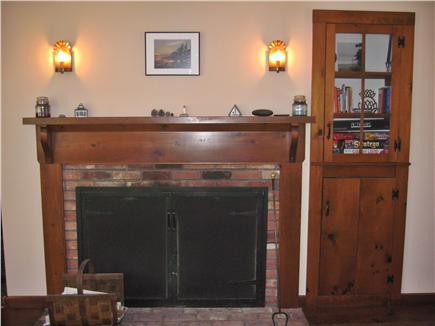 Harwich Center Cape Cod vacation rental - fireplace and game/book cabinet