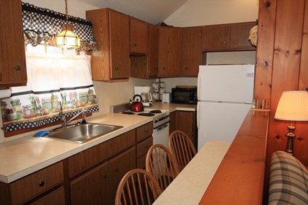 Dennis Port Cape Cod vacation rental - Galley kitchen with seating and eating peninsula