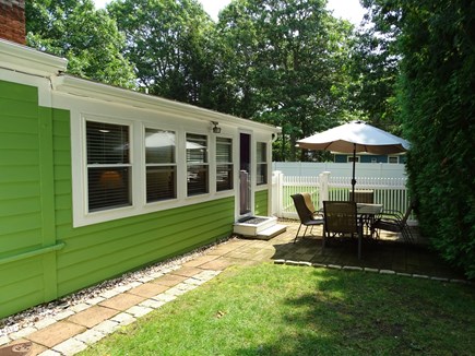 West Yarmouth Cape Cod vacation rental - Dining area opens to back yard dining with grill