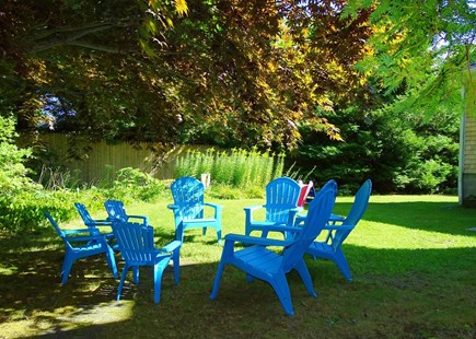 Chatham Cape Cod vacation rental - Private back yard with Adirondack chairs among gardens