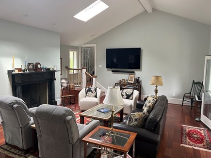 Brewster Dennis town line Cape Cod vacation rental - Living Rm with Fireplace and Large screen TV with surround sound