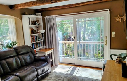 Osterville Centerville Barnstable Cape Cod vacation rental - Den with TV and recliner. Slider to deck and outdoor shower.
