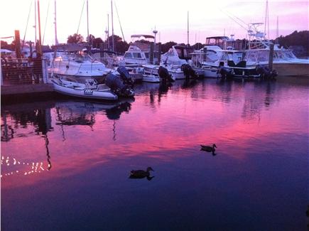 Woods Hole Cape Cod vacation rental - Sunset over the boats in the local marina called ''Eel Pond.''