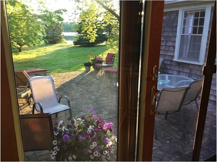 Brewster Cape Cod vacation rental - Brick Patio w Table for 6, Loungers, Chairs, Living Room View