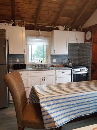 Dennisport Cape Cod vacation rental - Kitchen with refrigerator, stove, microwave.