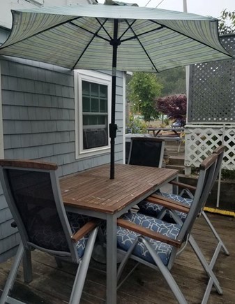 Dennisport Cape Cod vacation rental - Umbrella table for dining on the deck.