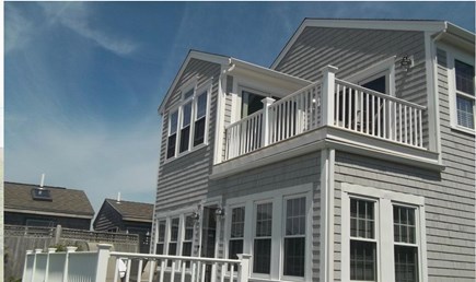 West Yarmouth Cape Cod vacation rental - Rear view of the home with relaxing decks and lovely ocean views.