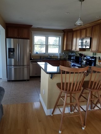 Eastham Cape Cod vacation rental - Natural Cherry Kitchen. S/S large Appliances. Bar Seating for 4