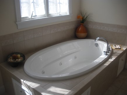 Falmouth Cape Cod vacation rental - master bathroom has jacuzzi tub  and shower