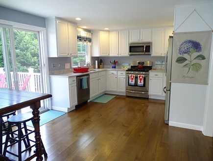 Brewster Cape Cod vacation rental - New cabinets, countertops, and appliances, opens to deck