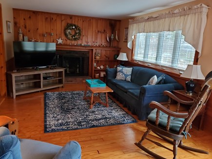 Dennisport Cape Cod vacation rental - Large fireplaced living room with queen size sleep sofa