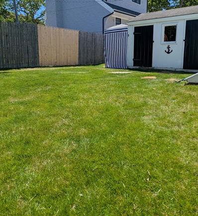 On Falmouth Harbor, Desirable  Cape Cod vacation rental - Large backyard with shed and outdoor cabana shower.