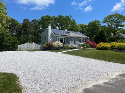 Sandwich Cape Cod vacation rental - Front of home with oversized driveway .