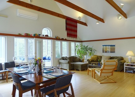 South Truro MA Cape Cod vacation rental - Vaulted living room includes dining area, leads to screened porch