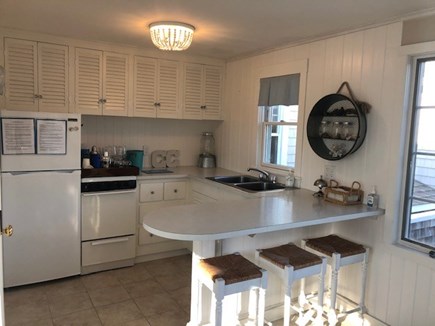 West Harwich Cape Cod vacation rental - Sunny family room has kitchenette, counter seating and Smart TV.