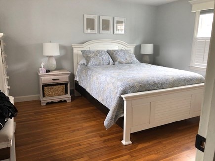 West Harwich Cape Cod vacation rental - This spacious primary bedroom & upstairs queen bedroom have a TV.