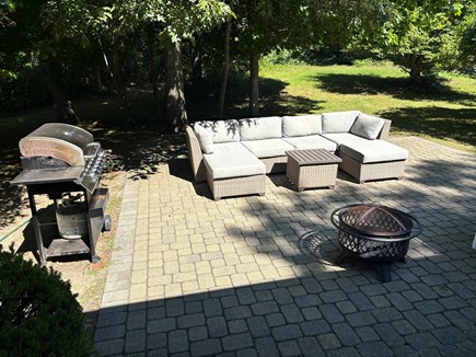 Hyannis area, by Covell's & Cr Cape Cod vacation rental - Rear patio with grill and firepit, groomed for privacy.