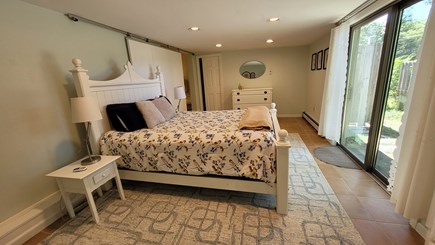 Orleans Cape Cod vacation rental - Queen bedroom.  Sliders to lower deck and outdoor shower.