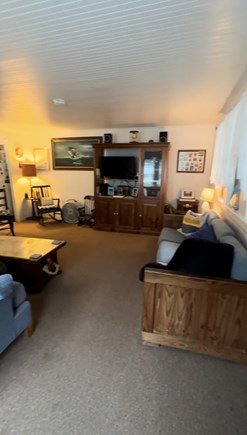 Eastham, Minutes from Campground Beach! Cape Cod vacation rental - Living room, entry to porch right, stairs, kitchen, dining left.