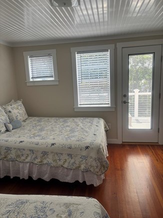 Eastham Cape Cod vacation rental - Second floor  bedroom with 2 queens and view to second floor deck