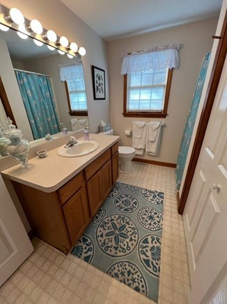 Harwich Cape Cod vacation rental - First floor bathroom with shower and laundry