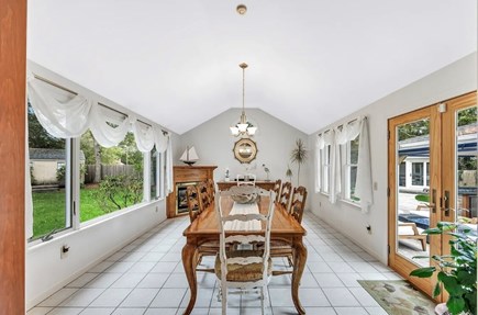West Yarmouth Cape Cod vacation rental - Dining room looking at the outdoor kitchen and yard