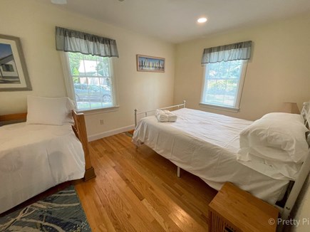Orleans Cape Cod vacation rental - First floor bedroom in the main house with a Queen bed, Twin and Twin trundle