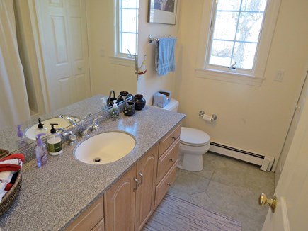 Orleans Cape Cod vacation rental - First floor bedroom in the main house with a Queen bed, Twin and Twin trundle
