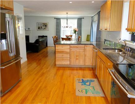 Wellfleet Cape Cod vacation rental - Kitchen area opens to dining are, sliders to deck