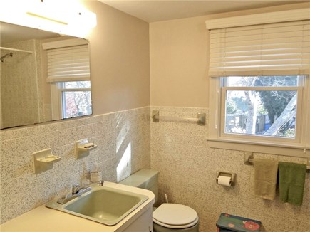 Chatham Cape Cod vacation rental - Upstairs full bathroom with tub and shower, view of the yard