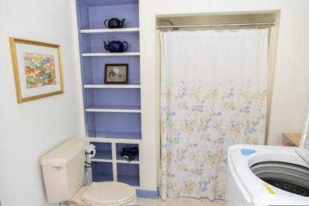 Chatham Cape Cod vacation rental - Master bathroom with shower with seat, and washer/dryer units