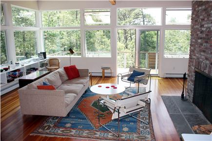 Wellfleet Cape Cod vacation rental - Living room area w/ doors to deck & view of woods & peeks of pond
