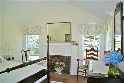 Harwichport near Bank Street B Cape Cod vacation rental - First floor master bedroom with fireplace