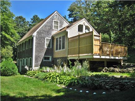 Brewster Cape Cod vacation rental - Side view with sunroom and deck