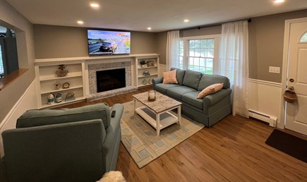 Dennis Cape Cod vacation rental - Living room with sofa, chairs, tv and fireplace