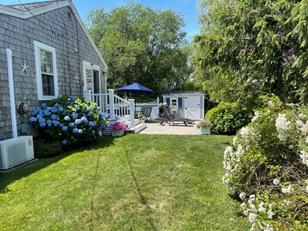 Barnstable Village Cape Cod vacation rental - Side of house with patio for relaxing