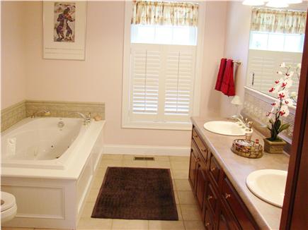 Brewster Cape Cod vacation rental - Downstairs master suite with 6' Jacuzzi and double sink.