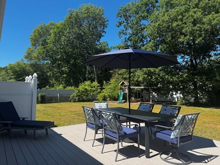 Centerville Cape Cod vacation rental - Large deck next to gas grill for outdoor dining and relaxing.