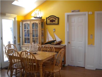 Dennis Port Cape Cod vacation rental - Dining room area with slider leading out to fenced-in back yard.