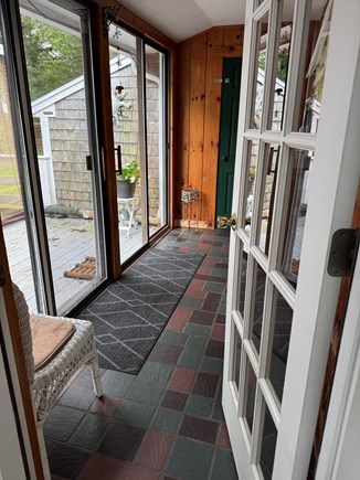 Long Pond, Harwich Cape Cod vacation rental - Breezeway with access to garage, deck and outside spaces.