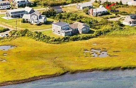 West Dennis Cape Cod vacation rental - View from the River to house red arrow is the house