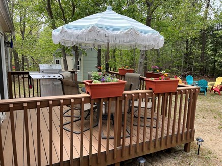 Eastham Cape Cod vacation rental - Deck with gas grill, seating for 6 @ a shed to store your bikes