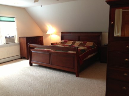 Wellfleet Cape Cod vacation rental - Master bedroom with couch and king bed.