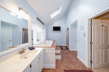 Sandwich, Cape Cod Cape Cod vacation rental - Private master bathroom w/TV, giant soaking tub and tiled shower.