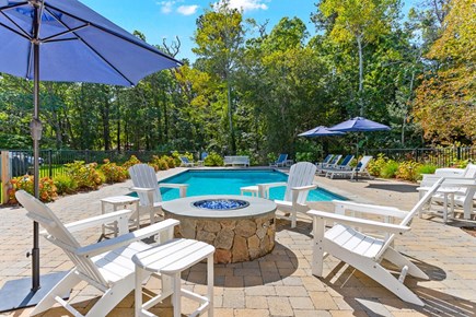 Brewster Cape Cod vacation rental - Pool hardscape includes a fire pit, a fantastic way to extend the evening.
