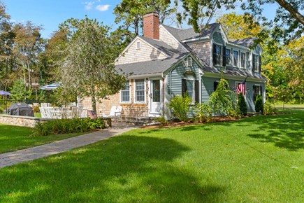 Brewster Cape Cod vacation rental - View of the house from the driveway. There is a large yard 0n the right side of the house where kids can play.