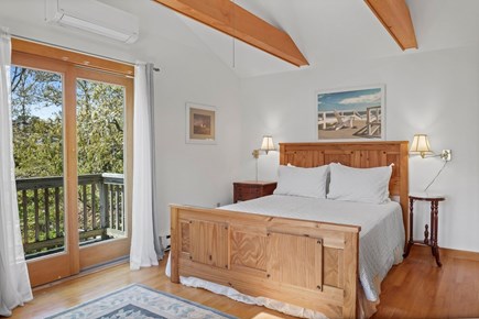 Chatham Cape Cod vacation rental - Master bedroom upstairs with TV and small deck.