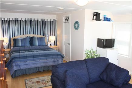 Bourne, Monument Beach Cape Cod vacation rental - Queen bed in studio cottage.  Love seat looks out over water.